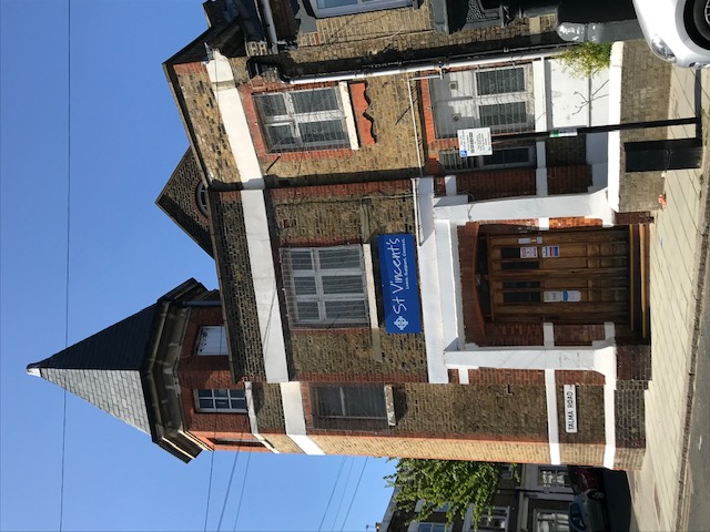 Exterior brownstone st vincent's brixton building, blue sky